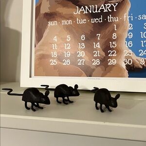 Three sweet cast iron black mice. 4 inches long from nose to tail.